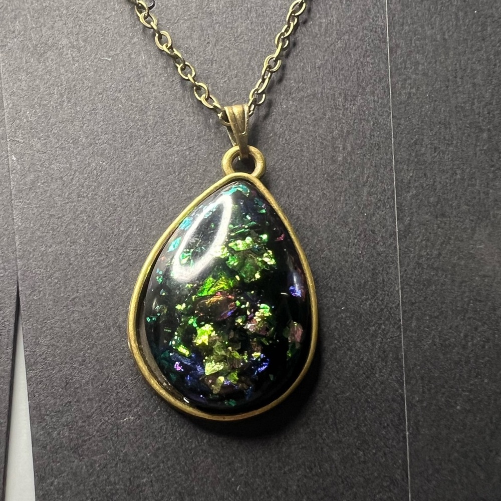 Handmade epoxy pendant necklace with green tint iridescent flakes